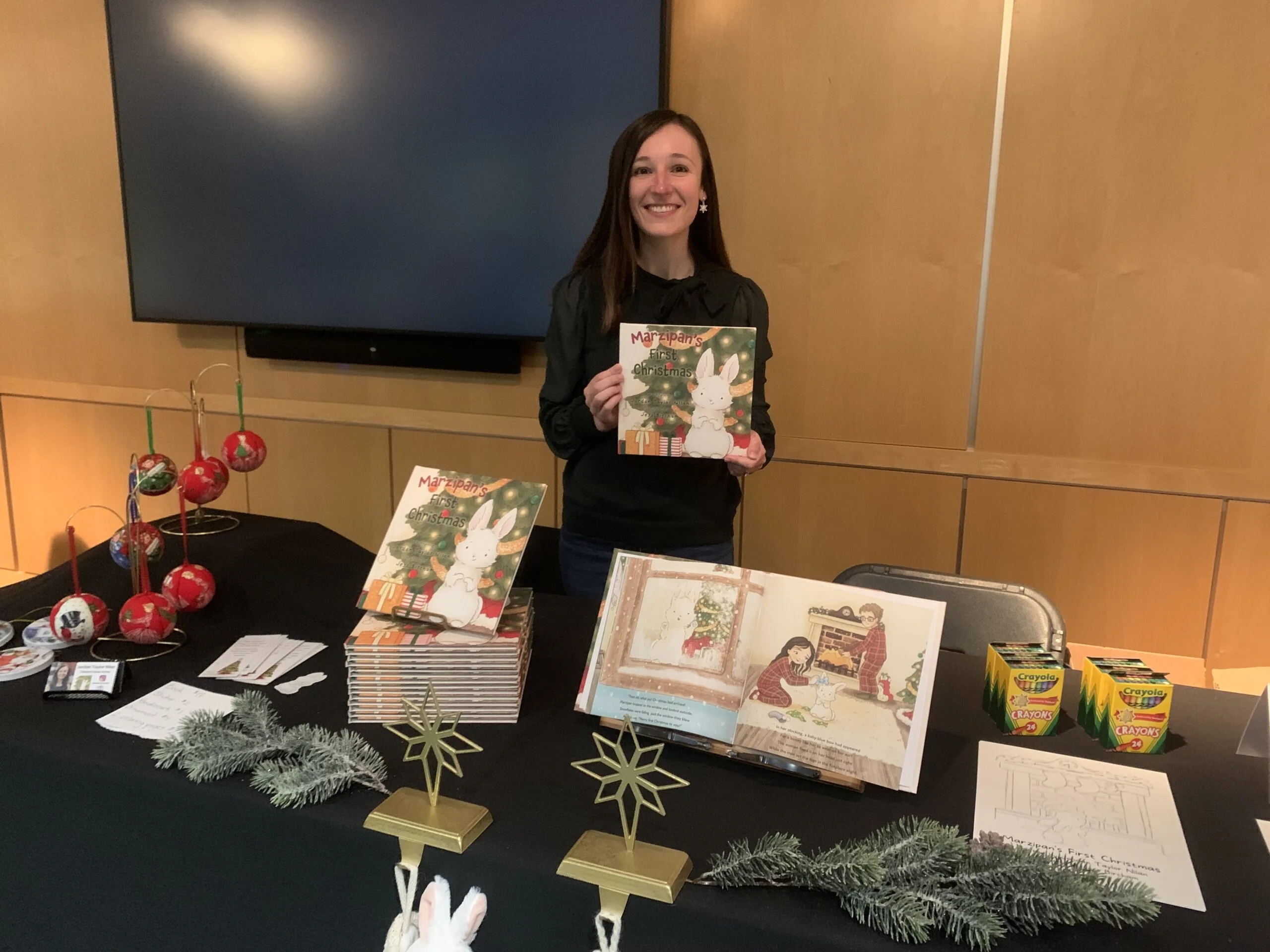 Illumination author Jordan Taylor Nilan displaying her award-winning book